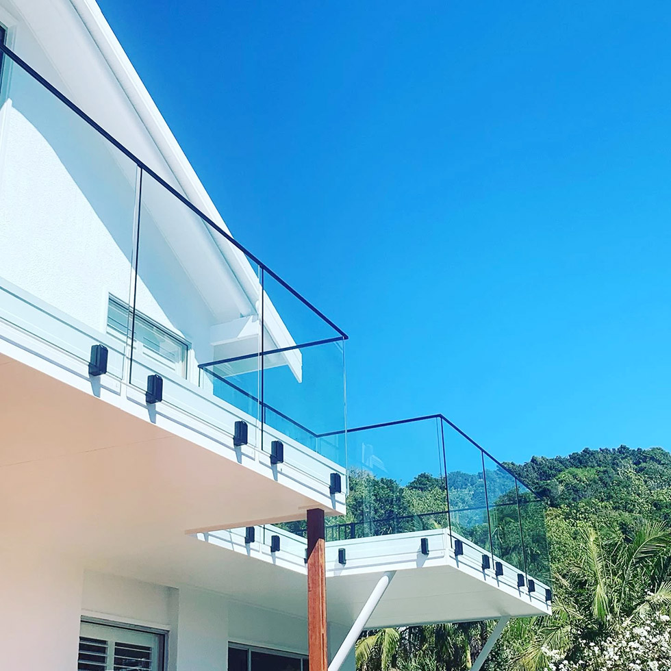 Glass Railings with Fascia Mounted Spigots with Top Cap Rails