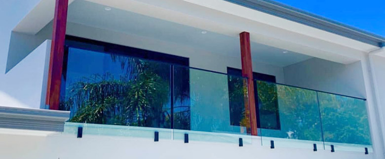 Glass Railings with Fascia Mounted Spigots with Top Cap Rails