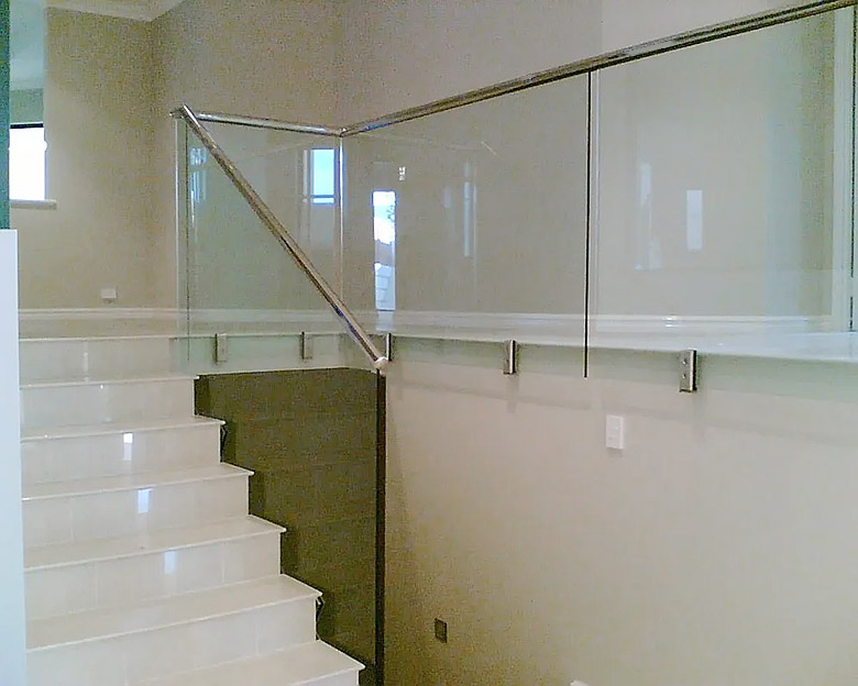 Glass Railings with Fascia Mounted Spigots with Top Cap Rails