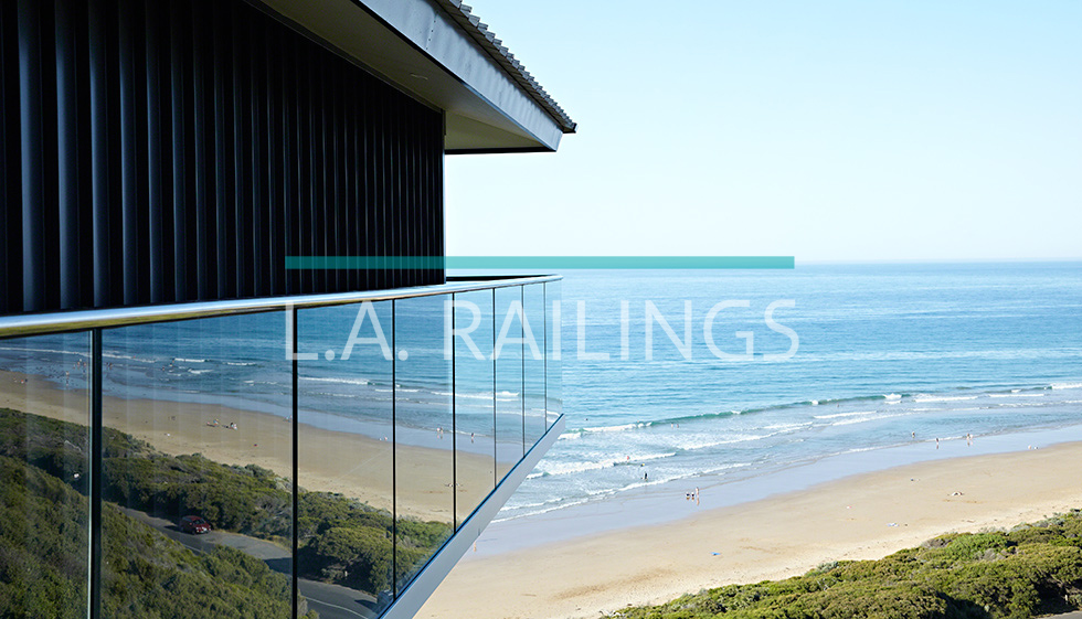 Glass Railings with Fascia Mounted U-Channel with Top Cap Rails